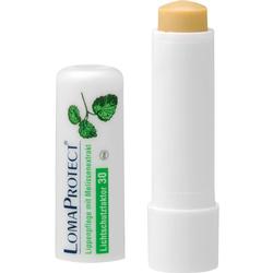 Ein Lippenpflegestift mit der Kappe daneben.
